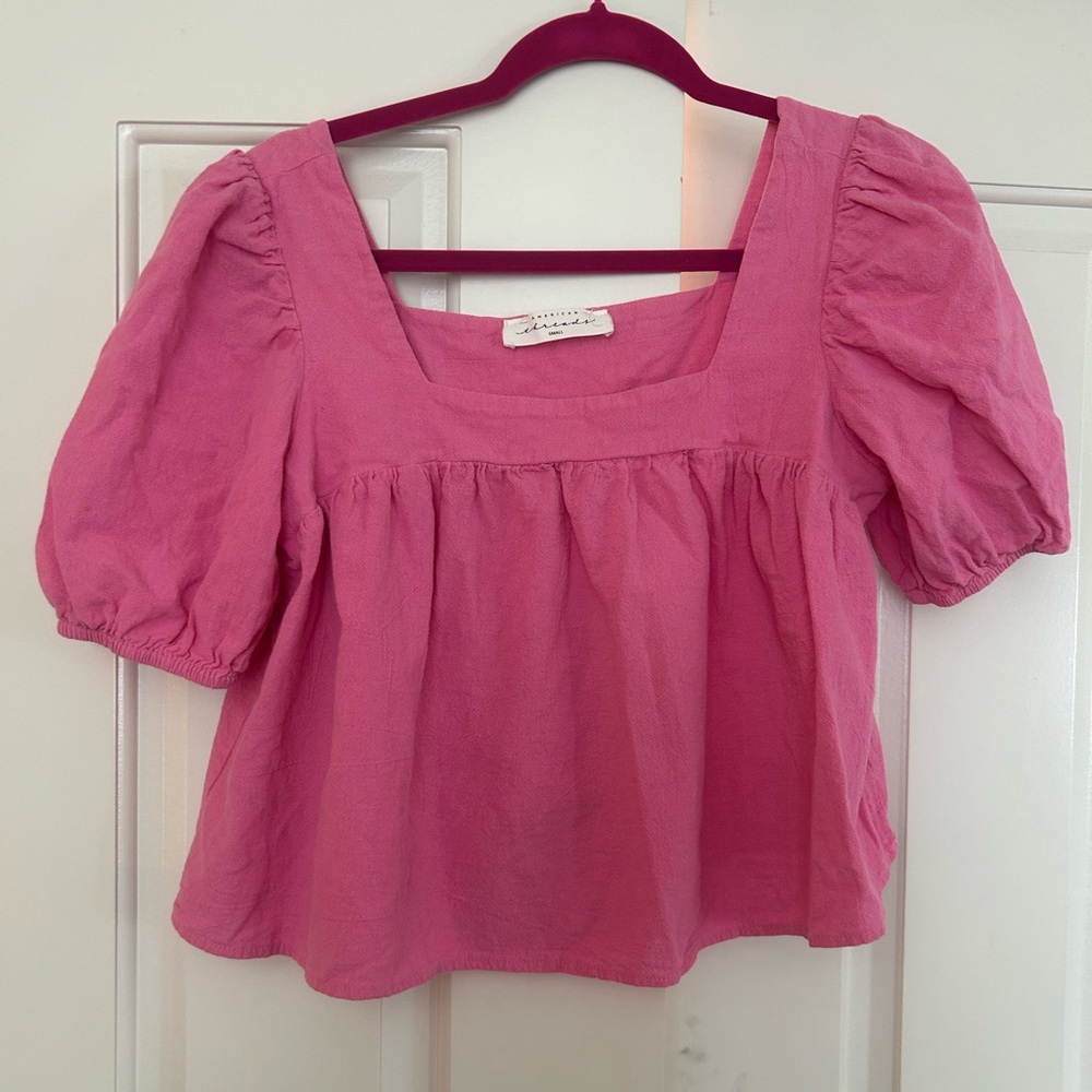 Pink shirt.